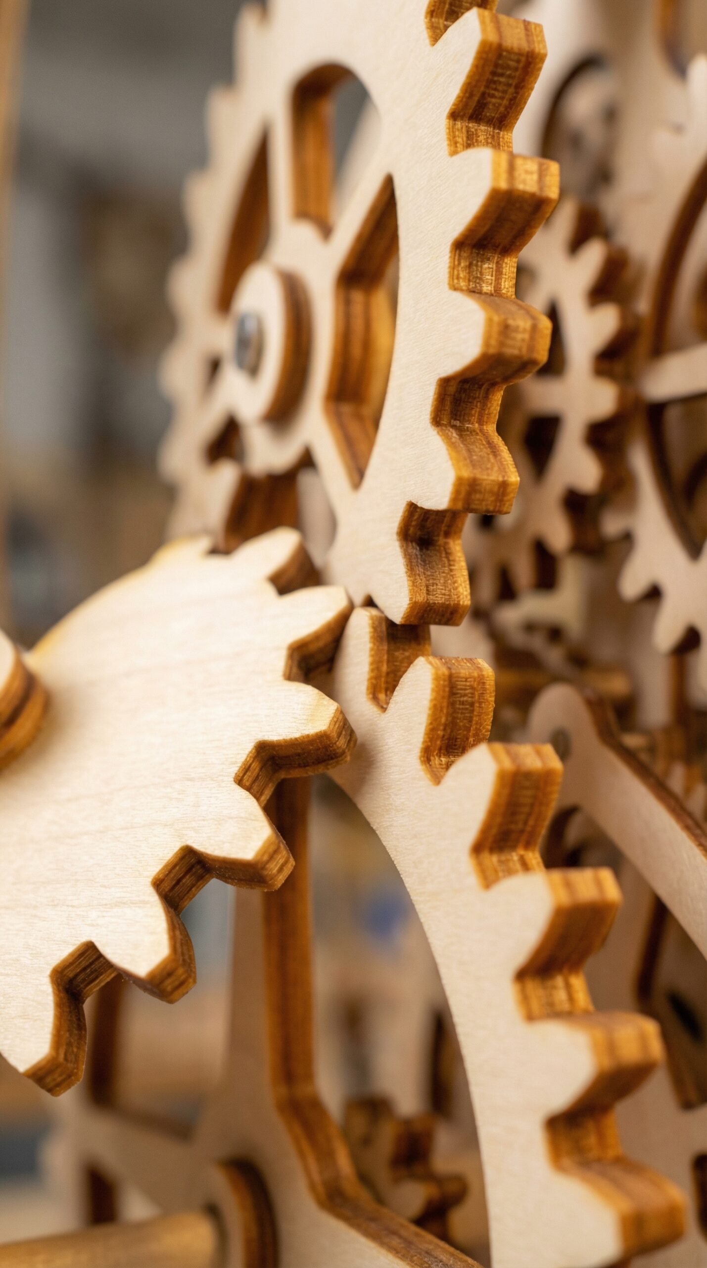 Macro shot of wooden gear teeth meshing perfectly showing solid inner ply layers and structural density