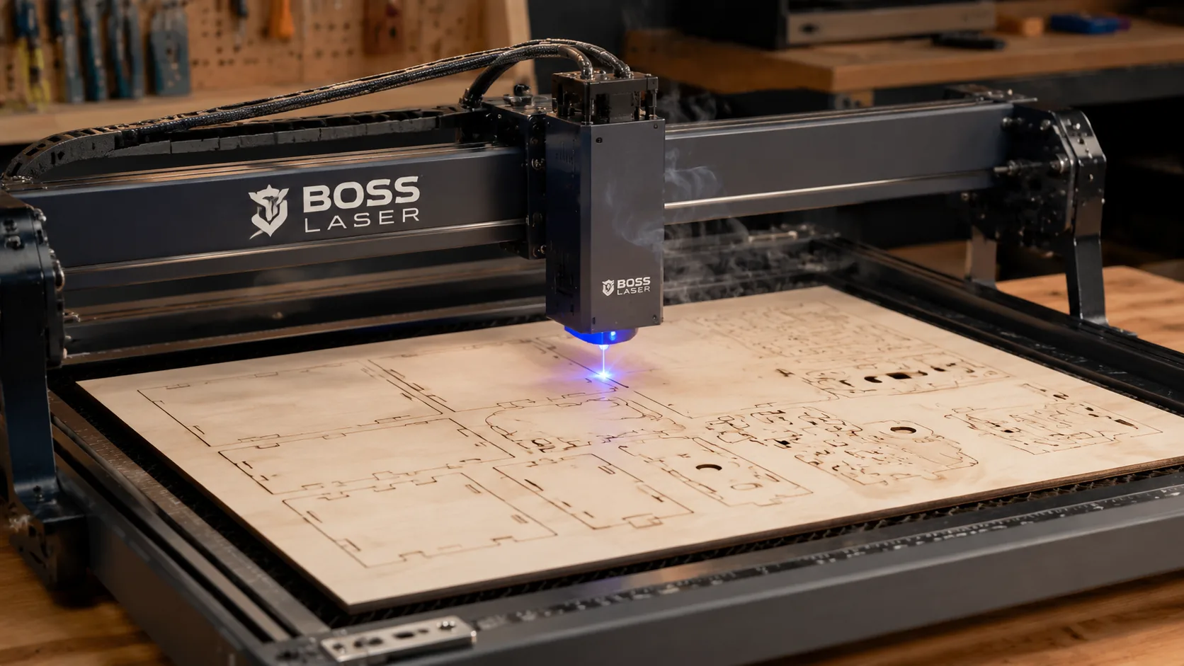 Boss Laser engraver cutting 3mm basswood sheet on workshop table