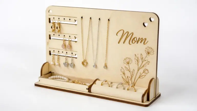 Finished laser-cut jewelry organizer made from 3mm basswood, displayed on workshop table