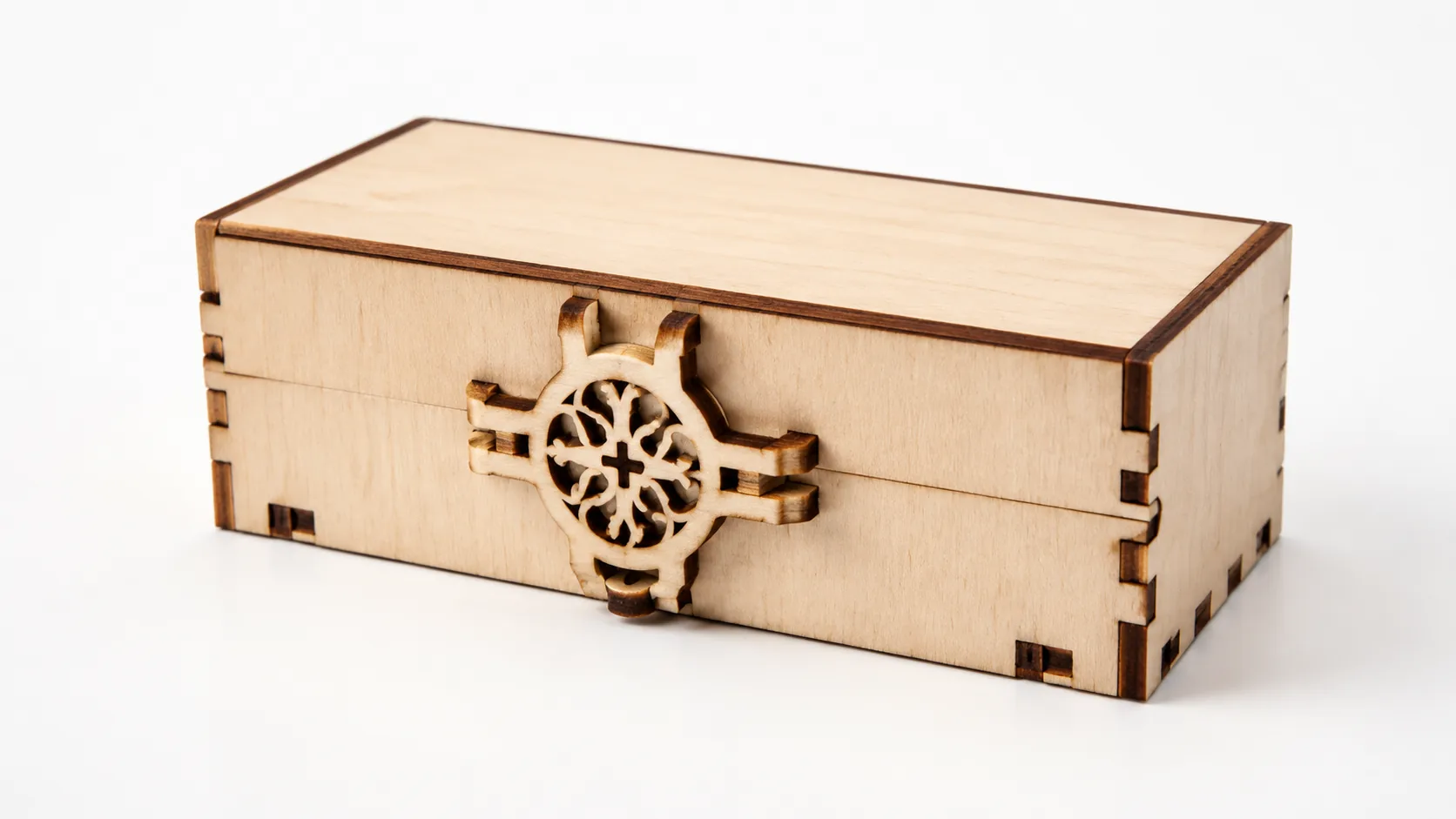 Finished laser-cut puzzle box made from 3mm basswood, displayed on workshop table