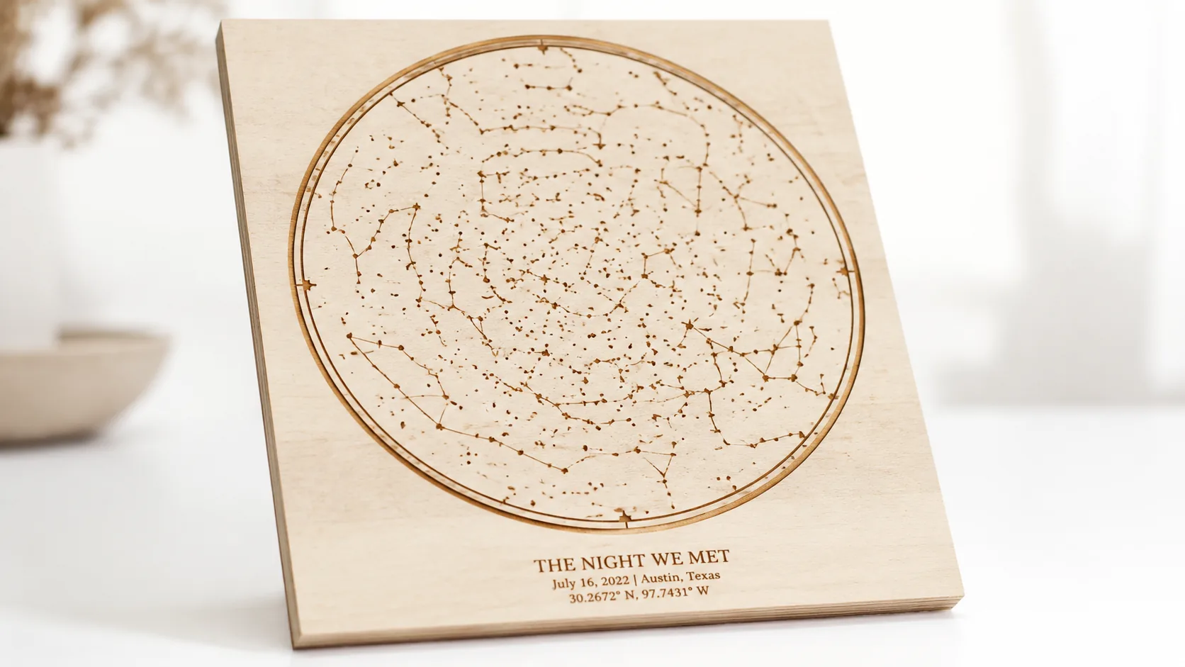 Personalized laser-engraved star map on 3mm basswood, displayed on a clean white surface at 3/4 angle, showing warm cream wood face and dark chocolate-brown laser-engraved edges