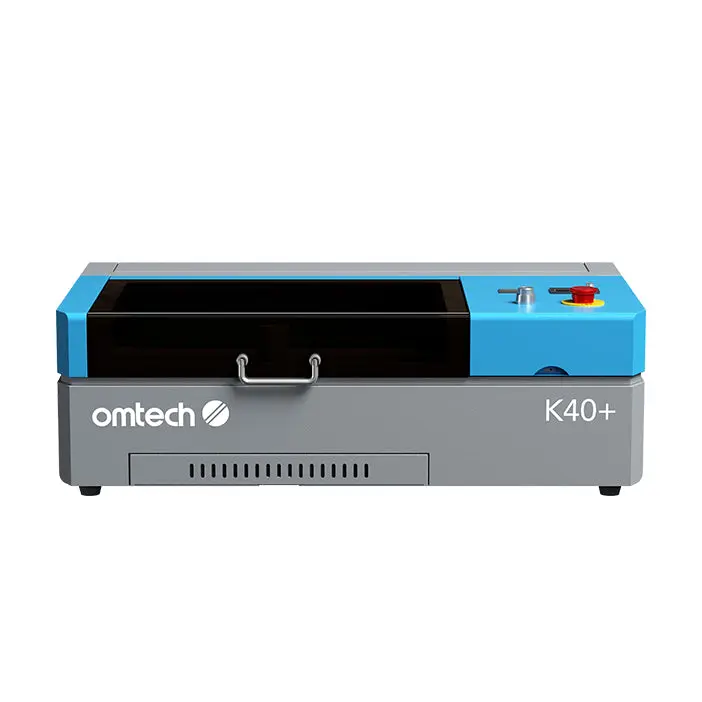 OMTech 40W laser engraver cutting 3mm basswood sheet on workshop table