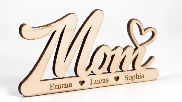 Finished laser-cut personalized mom name sign made from 3mm basswood, displayed on workshop table