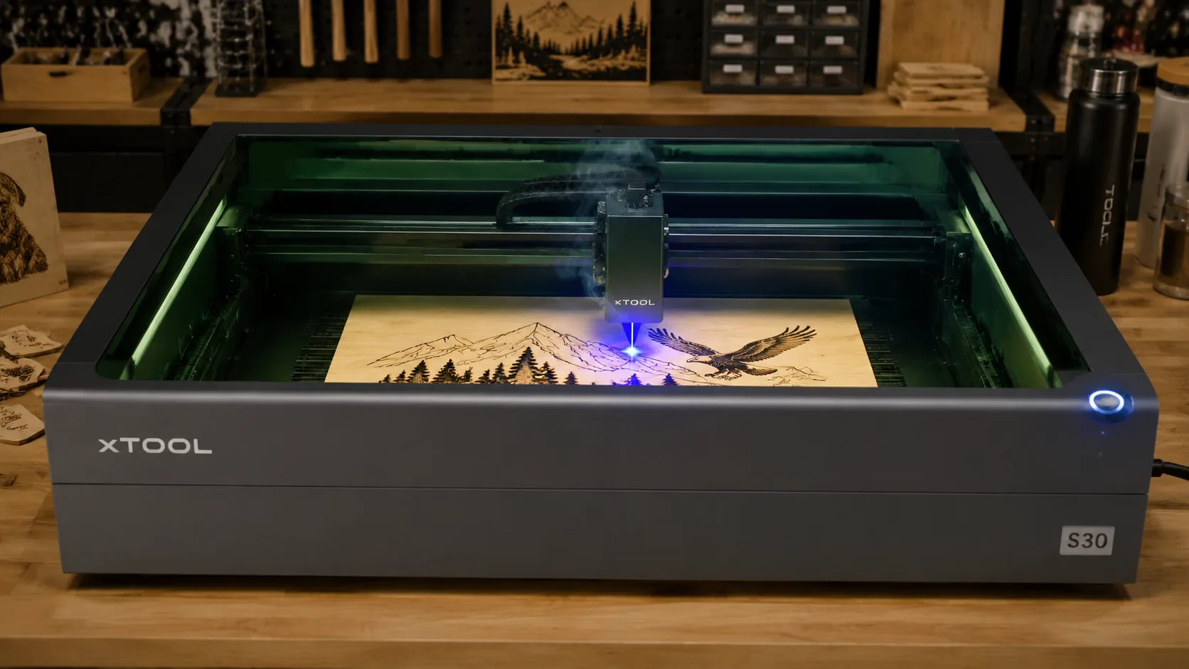 xTool S30 laser engraver cutting 3mm basswood sheet on workshop table